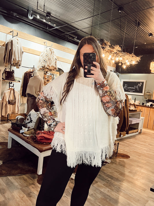 CABLE KNIT TURTLENECK FRINGE PONCHO